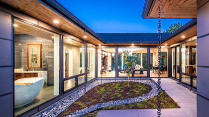 Modern house with a courtyard garden area and large windows