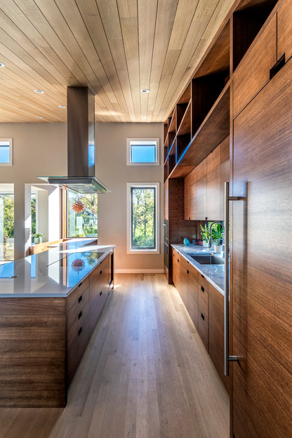 Modern kitchen with wooden cabinets and stainless steel appliances